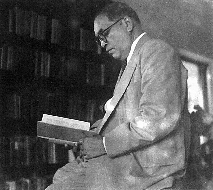 Dr. Ambedkar reading in his library